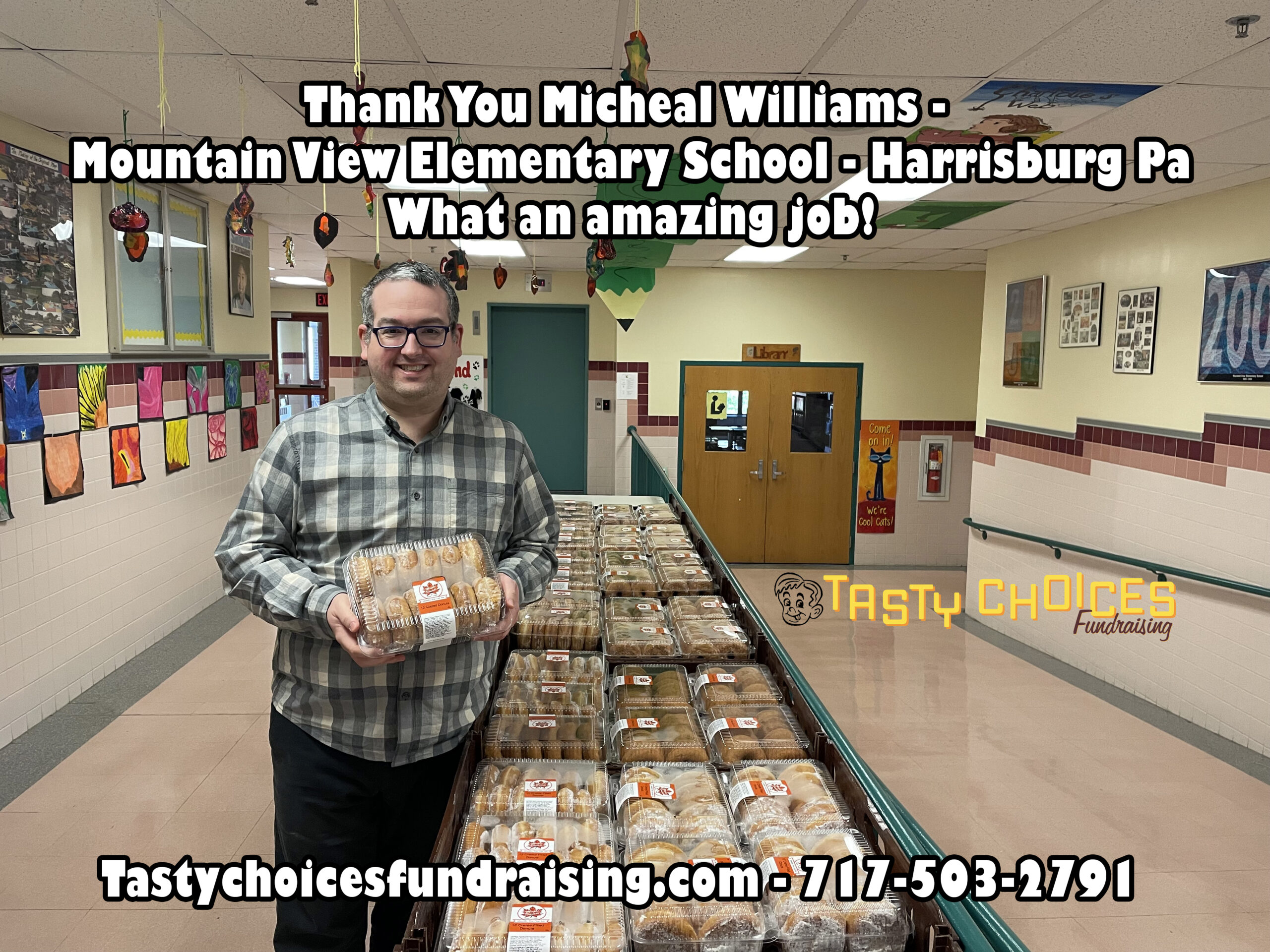 A man holding a package of donuts at a school in Harrisburg, PA for Tasty Choices Fundraising